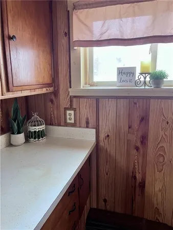 a kitchen with a sink and a window