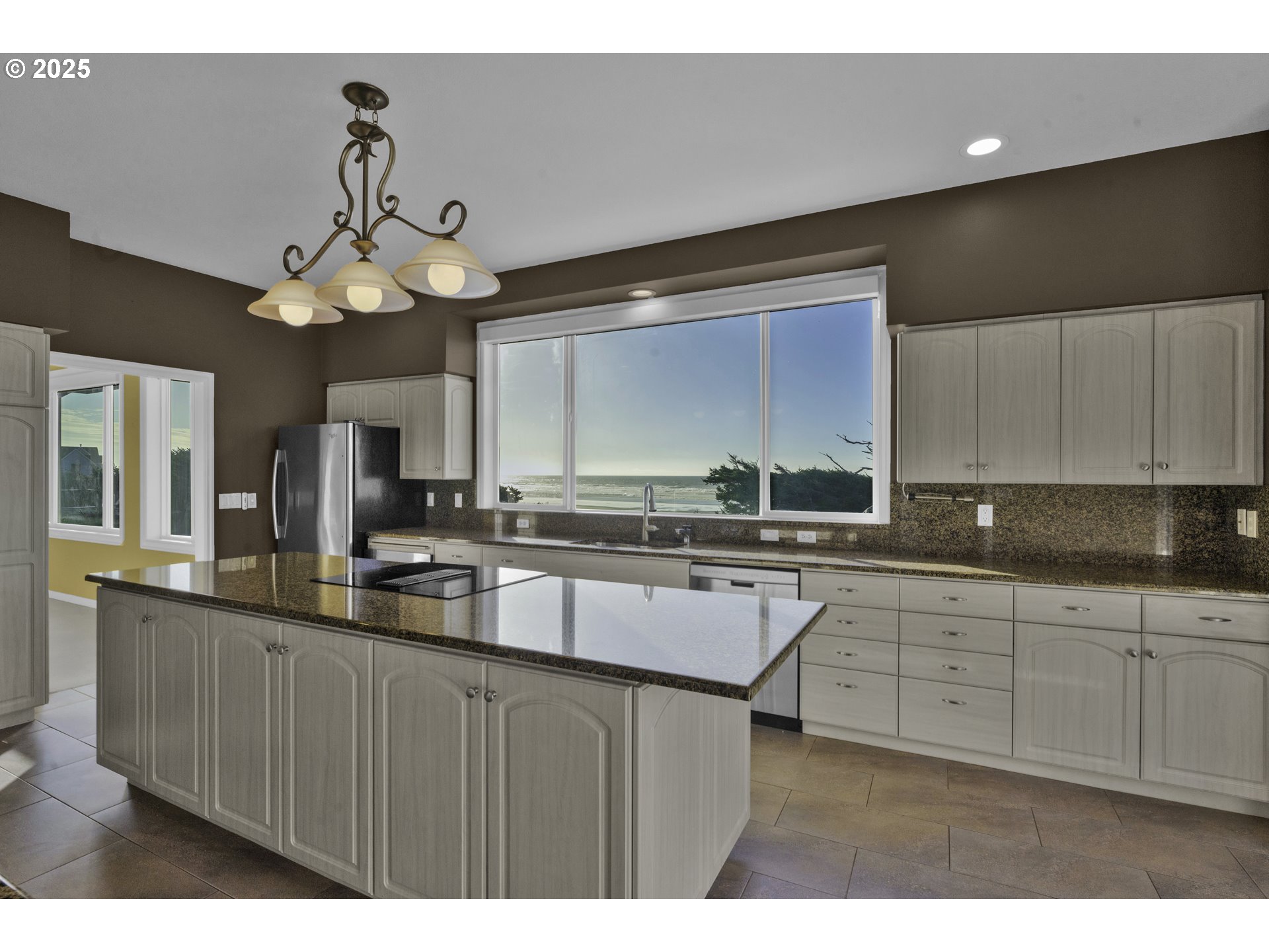 88765 Shoreline Loop Florence, OR 97439 - Photo 14 of 48 a kitchen with stainless steel appliances a sink a counter space cabinets and wooden floor