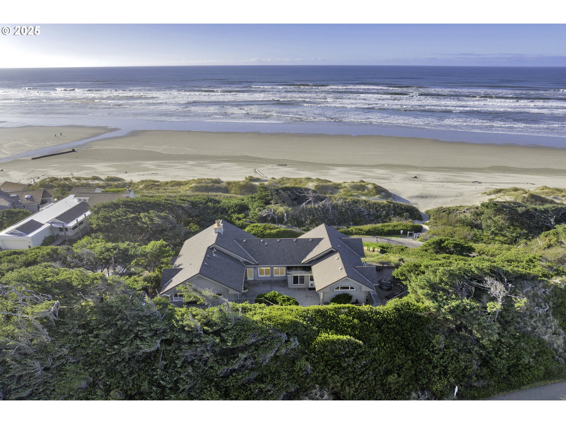 88765 Shoreline Loop Florence, OR 97439 - Photo 2 of 48 a view of an ocean and beach