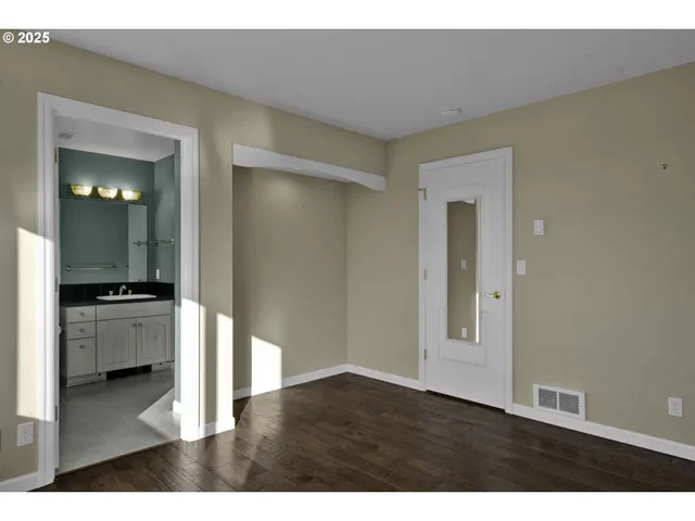 a room with furniture and large windows