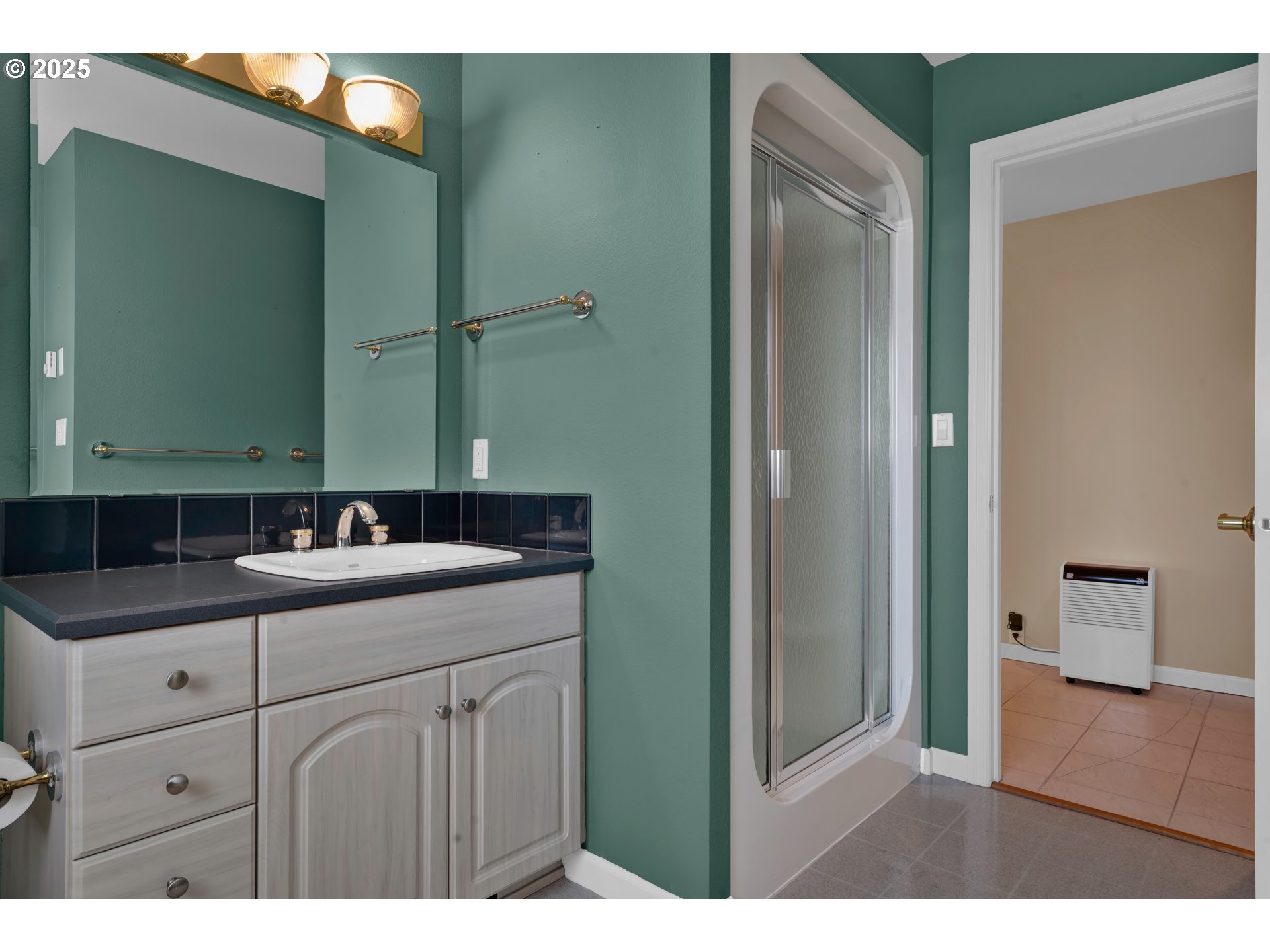 88765 Shoreline Loop Florence, OR 97439 - Photo 37 of 48 a bathroom with a sink and a mirror