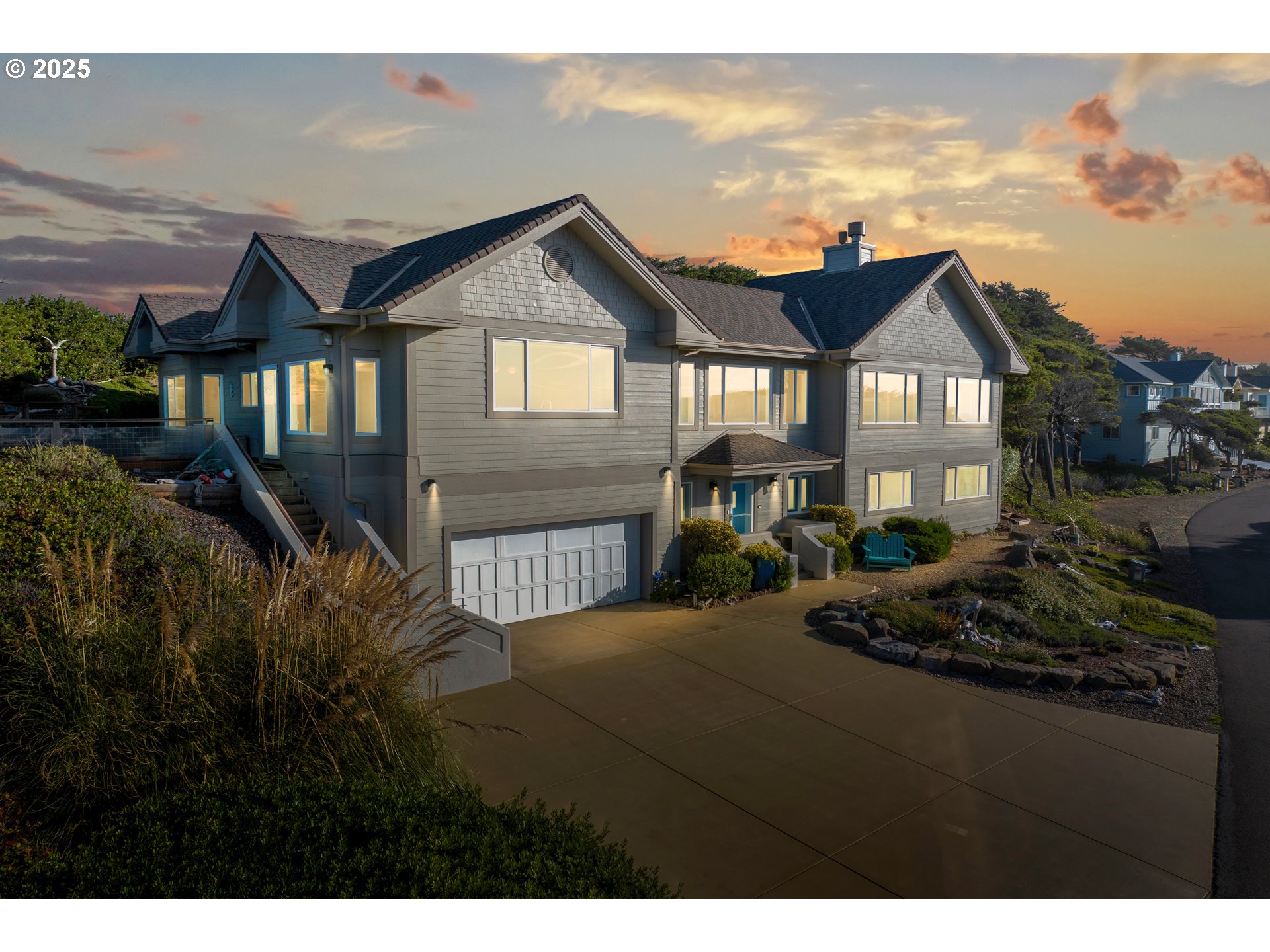 88765 Shoreline Loop Florence, OR 97439 - Photo 44 of 48 a front view of a house with a garden