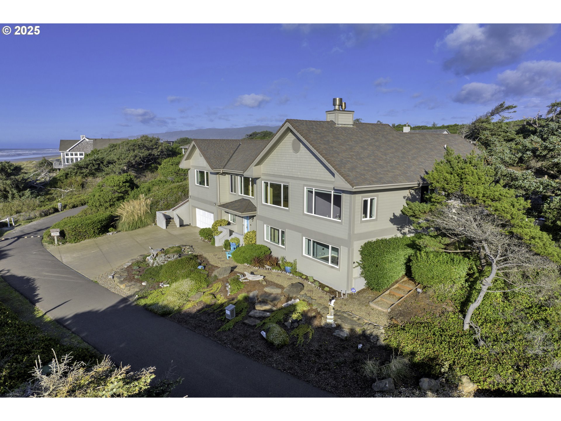 88765 Shoreline Loop Florence, OR 97439 - Photo 45 of 48 a aerial view of a house with a garden