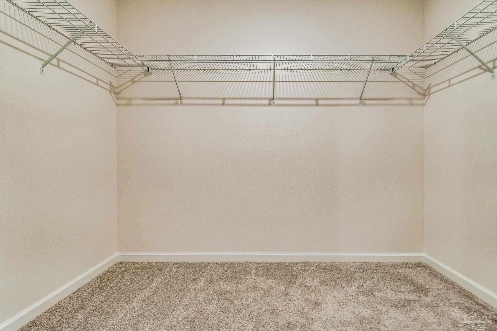 4777 Runway Drive Pace, FL 32571 - Photo 19 of 27 a view of a room with racks on the wall