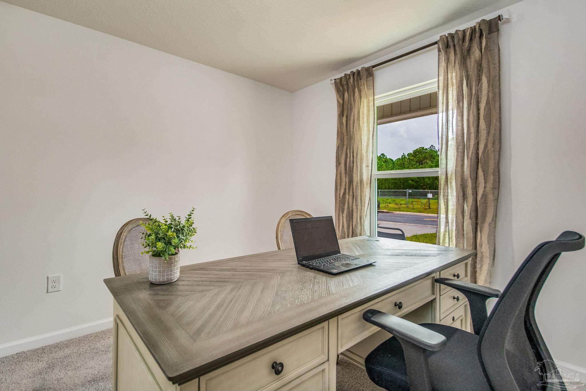 4777 Runway Drive Pace, FL 32571 - Photo 23 of 27 a dining room with furniture and window