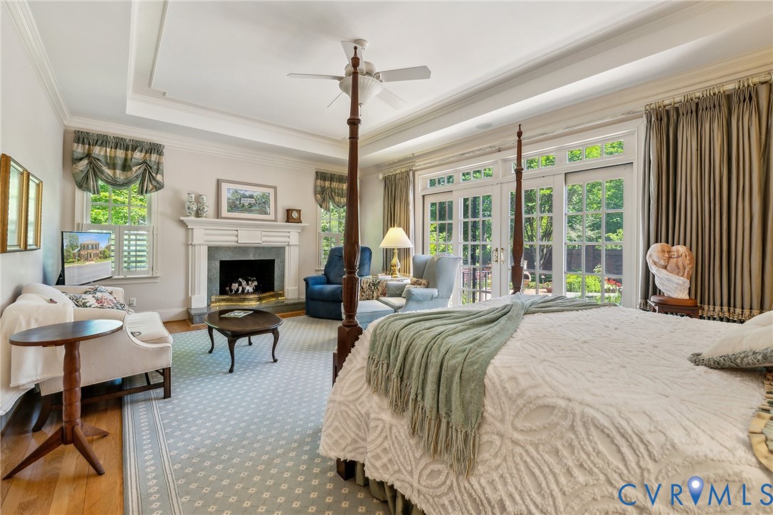 13901 Dunkeld Terrace Midlothian, VA 23113 - Photo 17 of 44 a spacious bedroom with a balcony a bed and a fireplace