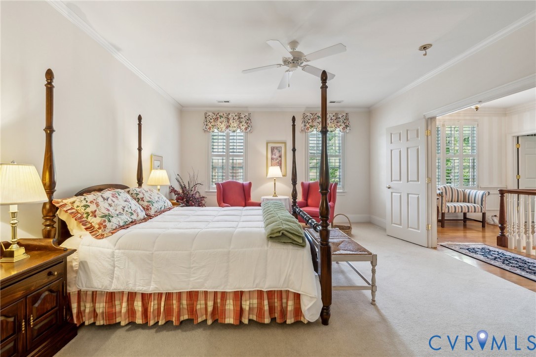 13901 Dunkeld Terrace Midlothian, VA 23113 - Photo 31 of 44 a bedroom with a bed a chandelier and dresser