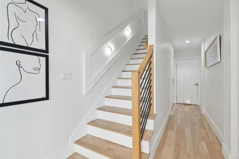 a bathroom with a sink toilet and a mirror