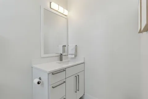 a bathroom with a shower toilet and sink