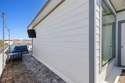 a view of a backyard with chairs