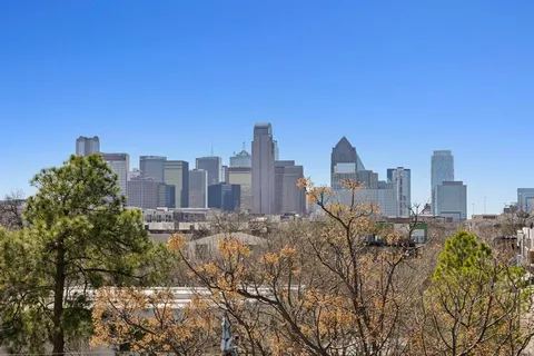 a view of a city with tall buildings in the background