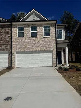 a front view of a house with yard
