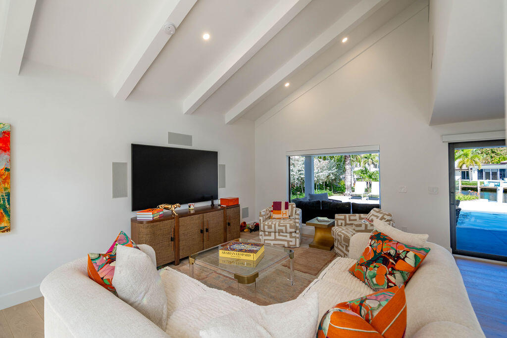 3001 Northeast 52nd Street Lighthouse Point, FL 33064 - Photo 17 of 61 a living room with furniture and a flat screen tv