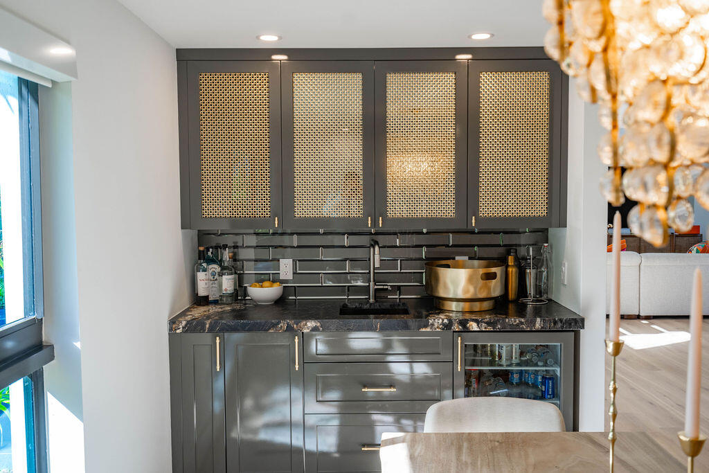 3001 Northeast 52nd Street Lighthouse Point, FL 33064 - Photo 20 of 61 a kitchen with stainless steel appliances granite countertop a stove a sink and a microwave