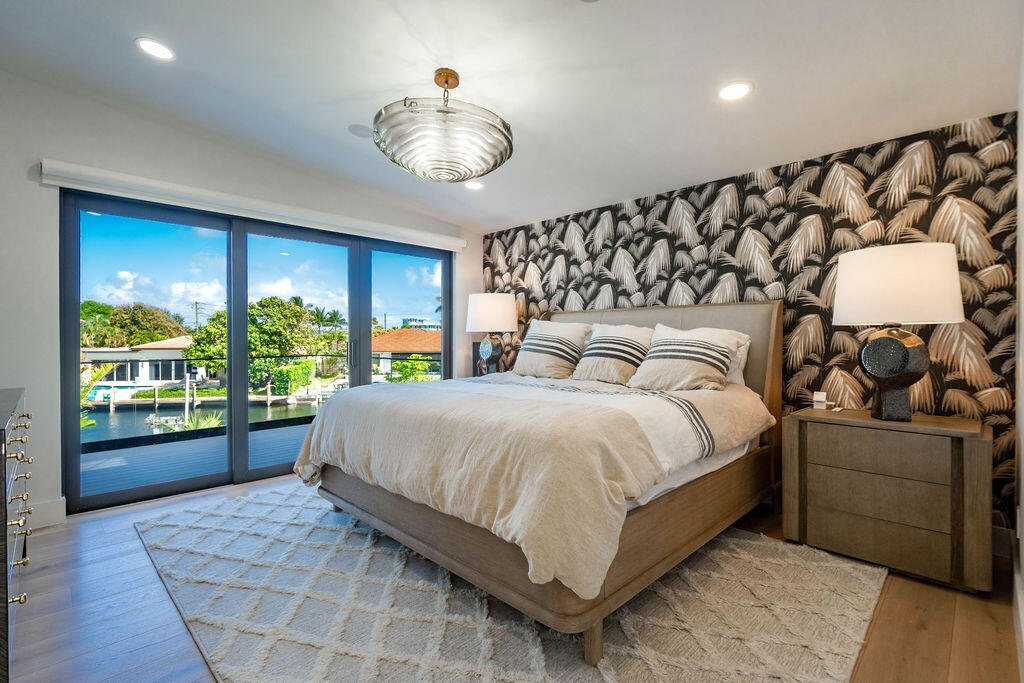 3001 Northeast 52nd Street Lighthouse Point, FL 33064 - Photo 29 of 61 a bedroom with a large bed and a large window