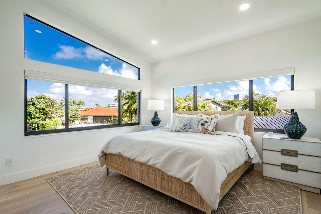 3001 Northeast 52nd Street Lighthouse Point, FL 33064 - Photo 37 of 61 a bedroom with a large bed and a large window