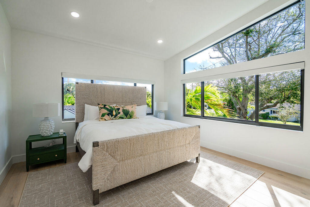 3001 Northeast 52nd Street Lighthouse Point, FL 33064 - Photo 39 of 61 a bedroom with a bed and a large window