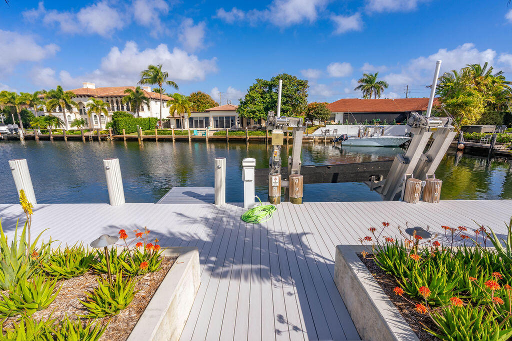 3001 Northeast 52nd Street Lighthouse Point, FL 33064 - Photo 54 of 61 a view of a house with wooden floor and lake view