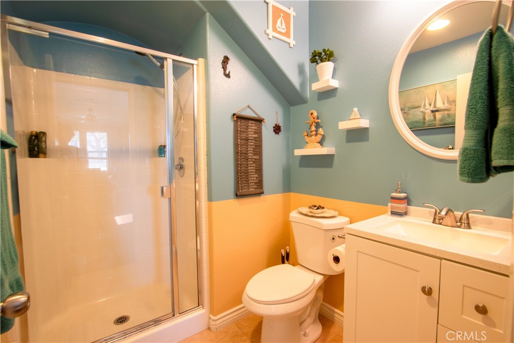 8090 Cornwall Court, Unit 38 Rancho Cucamonga, CA 91739 - Photo 20 of 47 a bathroom with a granite countertop sink toilet and shower