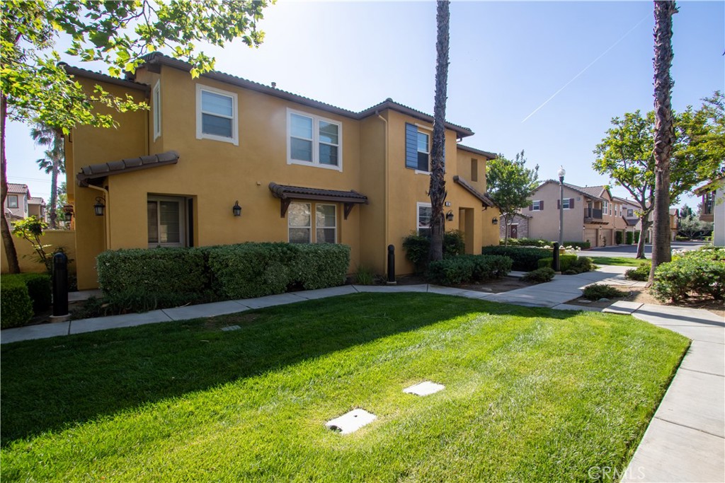 8090 Cornwall Court, Unit 38 Rancho Cucamonga, CA 91739 - Photo 2 of 47 a front view of a house with swimming pool having outdoor seating