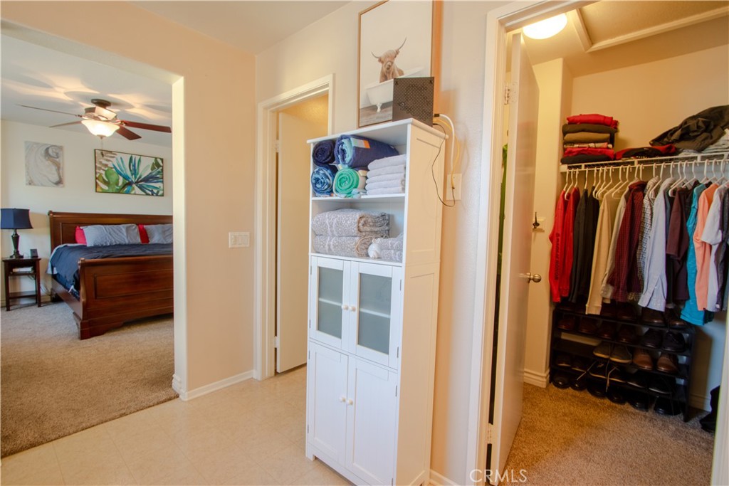 8090 Cornwall Court, Unit 38 Rancho Cucamonga, CA 91739 - Photo 27 of 47 a view of walk in closet with clothes and shoes