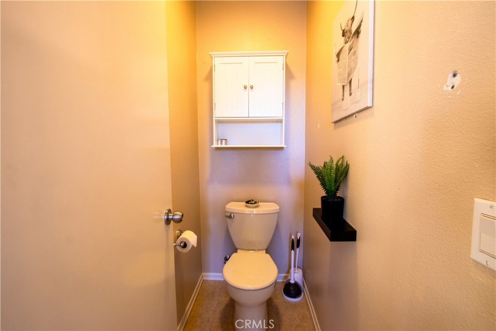 8090 Cornwall Court, Unit 38 Rancho Cucamonga, CA 91739 - Photo 28 of 47 a bathroom with a toilet and a sink