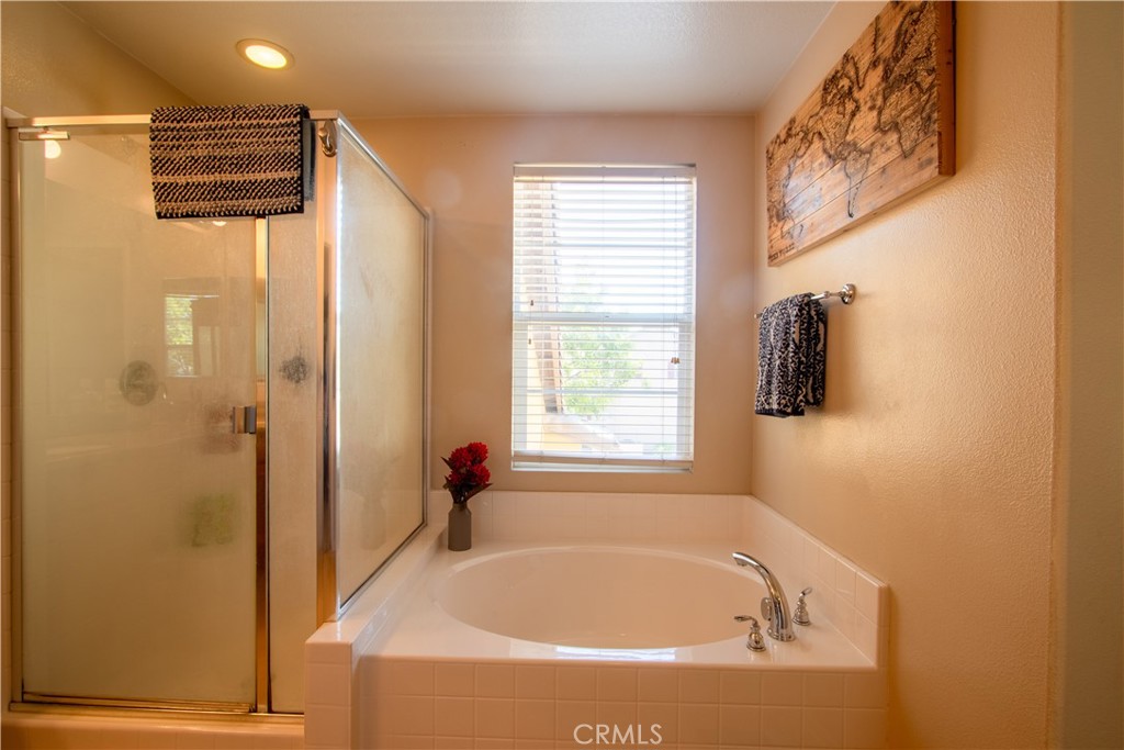 8090 Cornwall Court, Unit 38 Rancho Cucamonga, CA 91739 - Photo 29 of 47 a white bath tub sitting next to a window