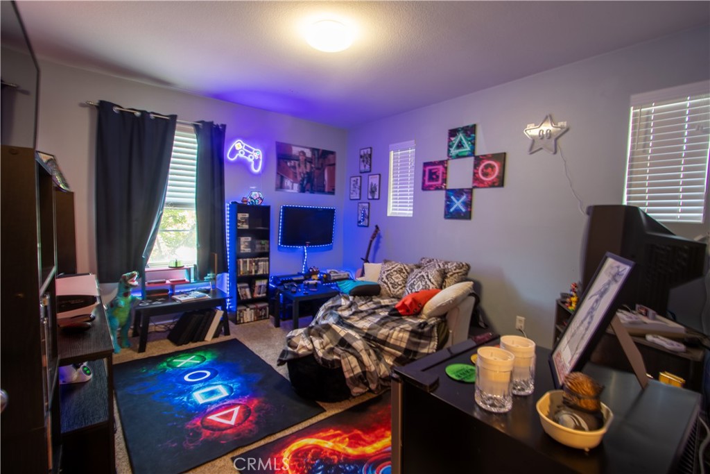 8090 Cornwall Court, Unit 38 Rancho Cucamonga, CA 91739 - Photo 33 of 47 a living room with furniture and a flat screen tv