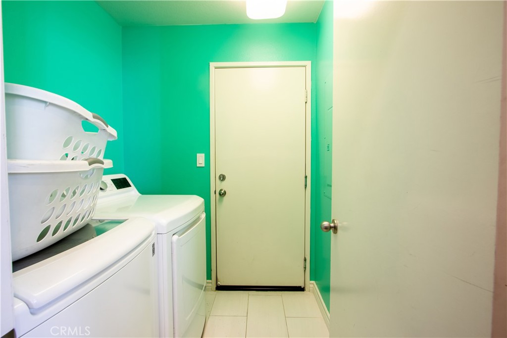 8090 Cornwall Court, Unit 38 Rancho Cucamonga, CA 91739 - Photo 34 of 47 a utility room with dryer and washer