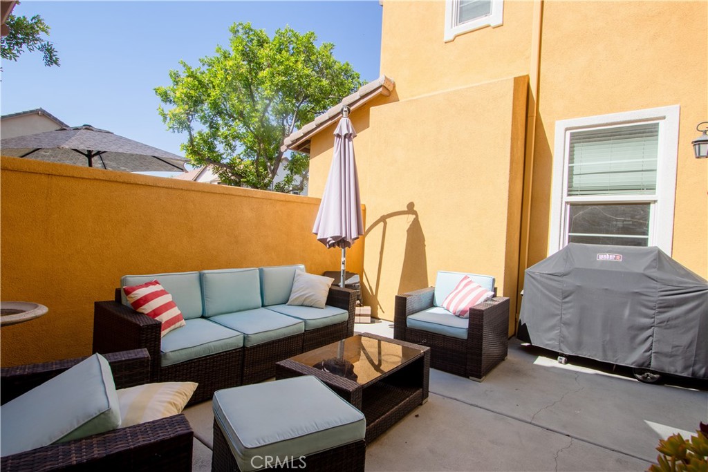 8090 Cornwall Court, Unit 38 Rancho Cucamonga, CA 91739 - Photo 35 of 47 a outdoor living space with furniture and a potted plant