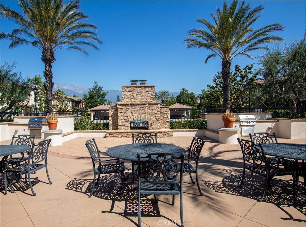 8090 Cornwall Court, Unit 38 Rancho Cucamonga, CA 91739 - Photo 43 of 47 a view of a backyard with a patio and outdoor seating