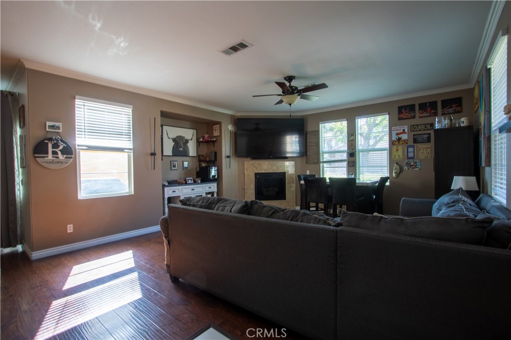 8090 Cornwall Court, Unit 38 Rancho Cucamonga, CA 91739 - Photo 5 of 47 a living room with furniture and a flat screen tv