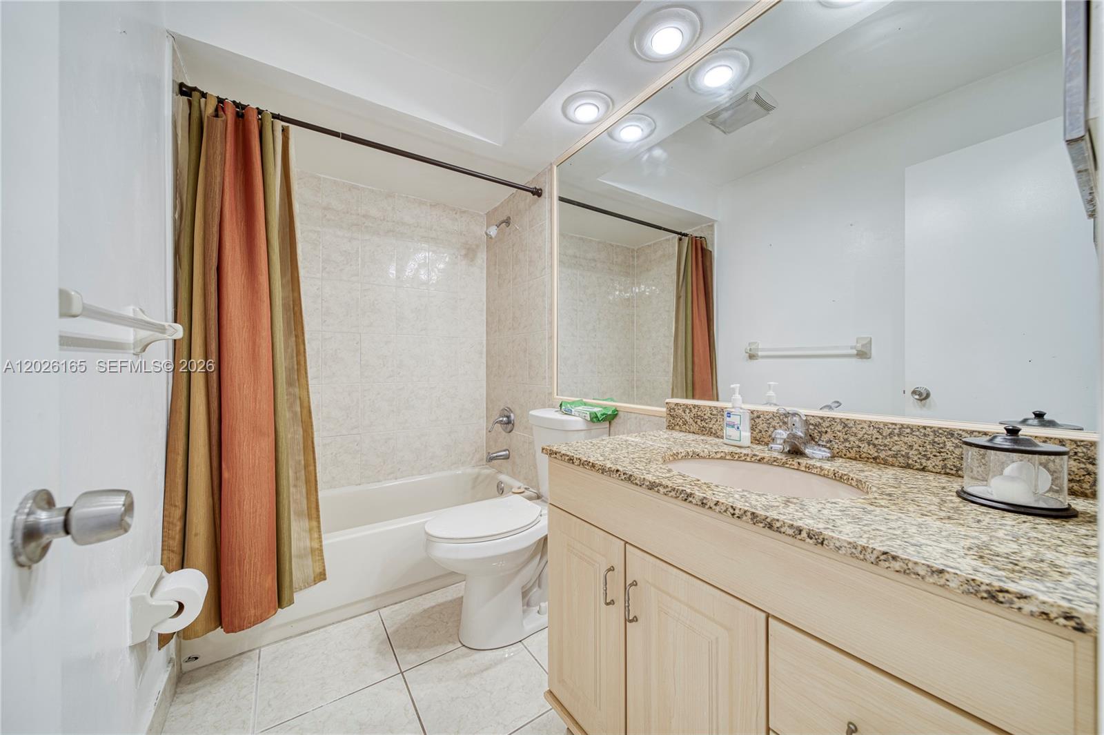13337 Southwest 64th Lane Miami, FL 33183 - Photo 28 of 36 a bathroom with a granite countertop sink toilet and shower