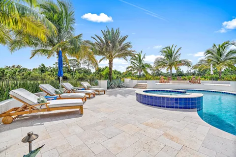 a large kitchen with a table and chairs
