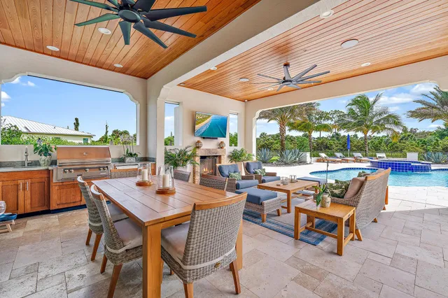 a kitchen with stainless steel appliances white cabinets and a window