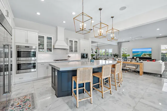 a bathroom with a tub a double vanity sink a large mirror and a shower