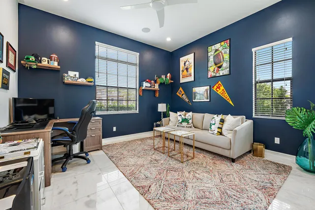 a spacious bedroom with a bed and wooden floor