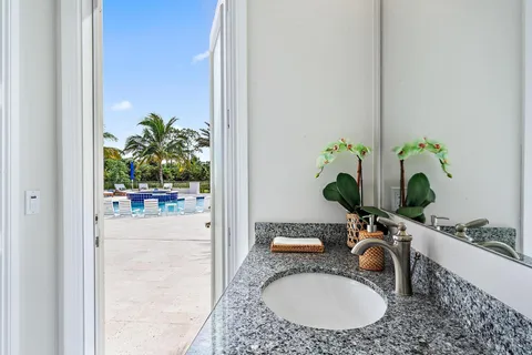 a en suite bathroom with double sink and a mirror