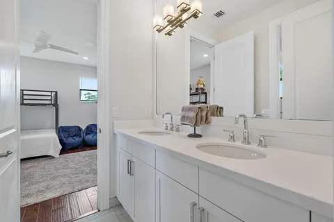 a view of a street with a car parked on the road