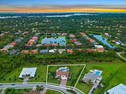 a view of a house with swimming pool