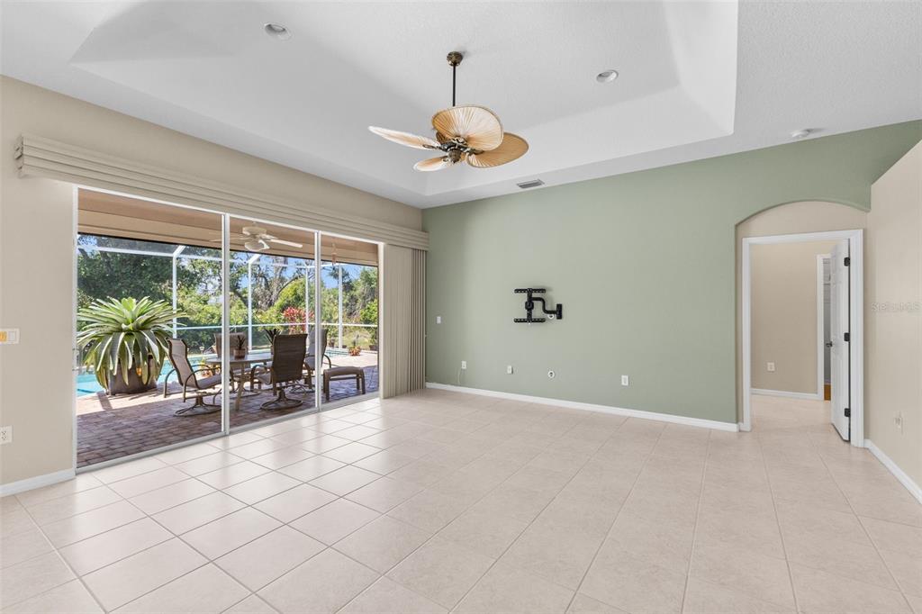 6532 Copper Ridge Trail Bradenton, FL 34201 - Photo 13 of 42 Living room & sliding glass doors to the pool/lanai