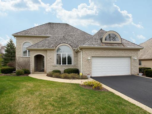 9 Torrin Rocks Cove Inverness, IL 60010 - Photo 1 of 1 a front view of a house with a yard and garage