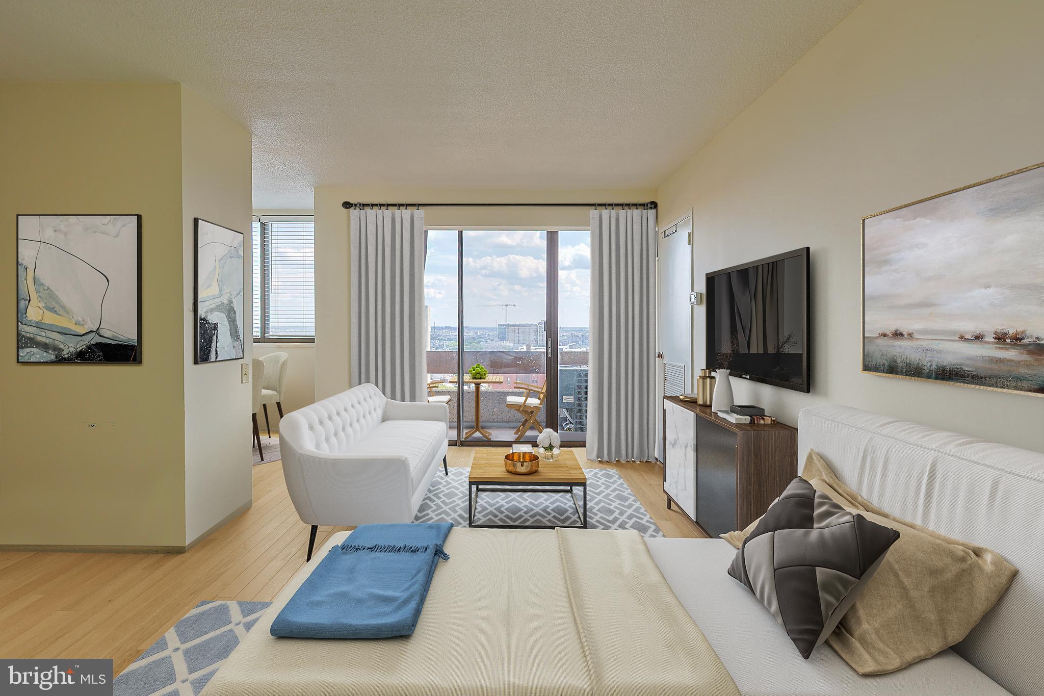 1326 Spruce Street, Unit 1602 Philadelphia, PA 19107 - Photo 1 of 11 a living room with furniture and a flat screen tv