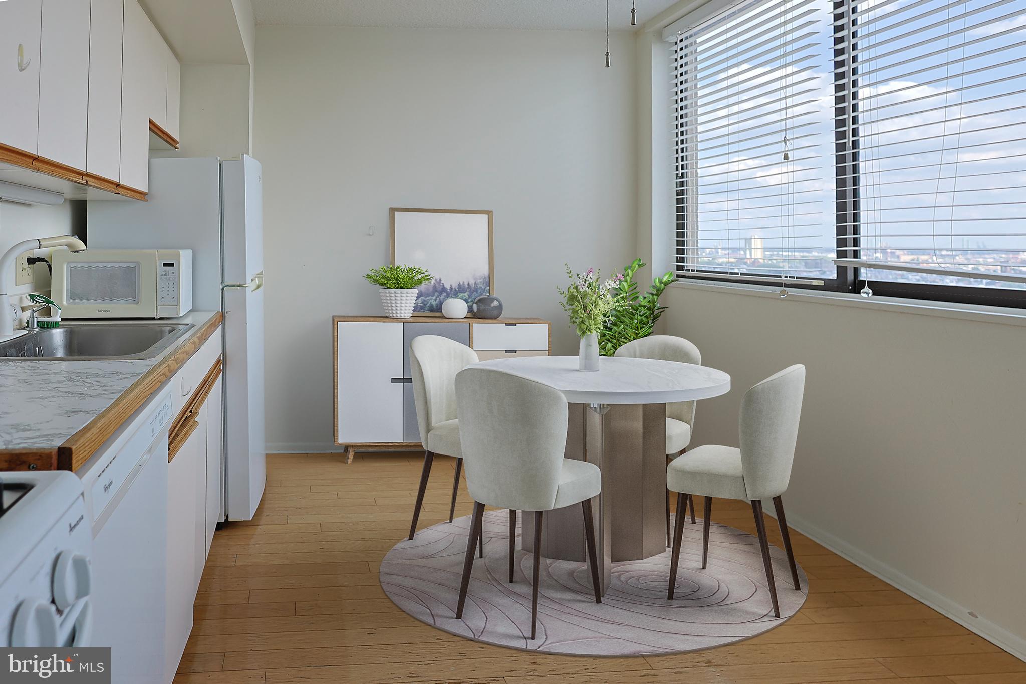 1326 Spruce Street, Unit 1602 Philadelphia, PA 19107 - Photo 2 of 11 a dining room with furniture and window