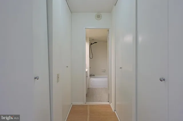 a view of a bathroom from a hallway