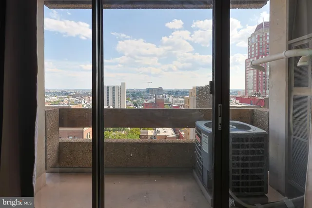 a view of a city from a room