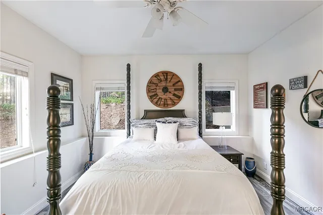 a bedroom with a large bed and a window