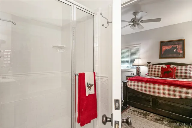 a bedroom with a bed and a book shelf