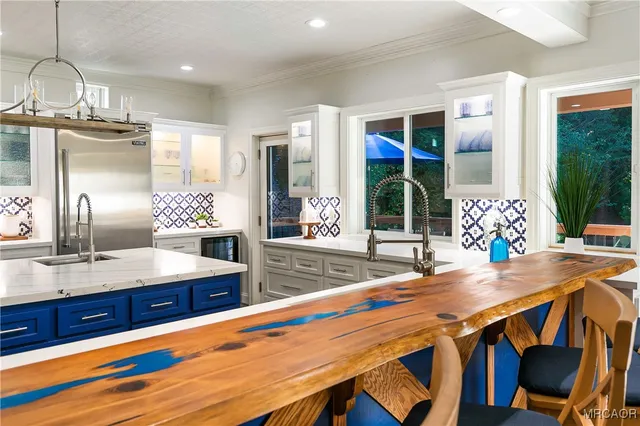 a kitchen with a table and chairs