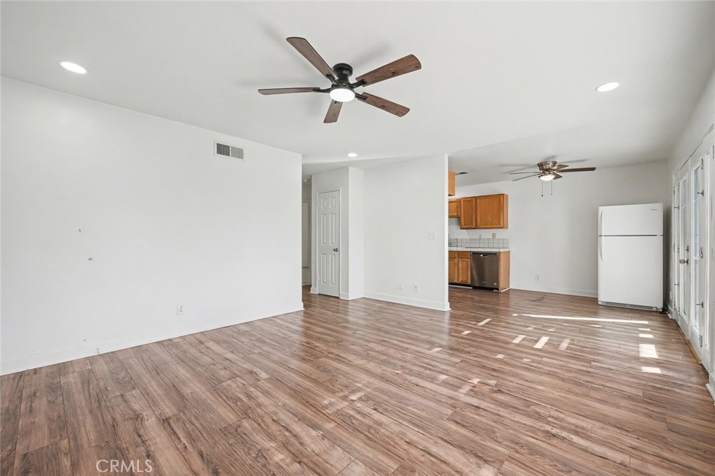 23517 Twin Spring Lane Diamond Bar, CA 91765 - Photo 13 of 40 a view of empty room with wooden floor and ceiling fan